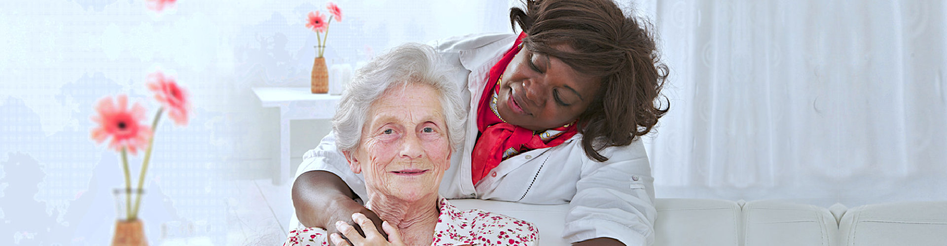 old woman smiling with her caregiver